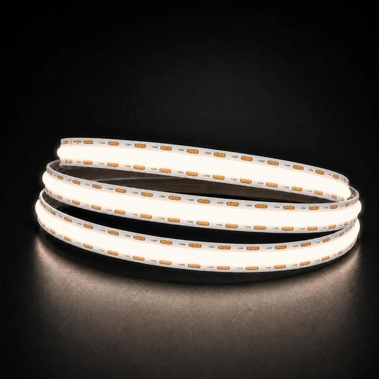 Natural White 4000K COB LED strip coil illuminated on a dark background, 24V DC and 10mm wide.