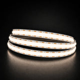 Natural White 4000K COB LED strip coil illuminated on a dark background, 24V DC and 10mm wide.