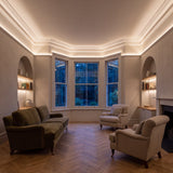 Warm White 2700K COB LED strip ceiling coving lighting in a large British living room in the evening; installation illustration.