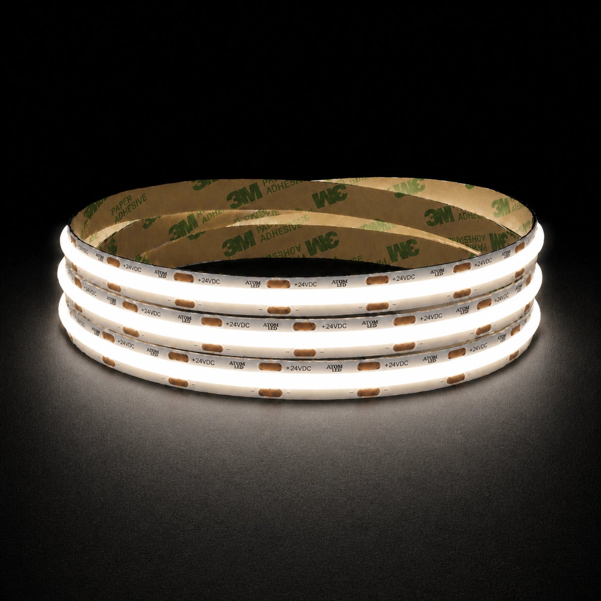 Natural White 4000K 24V 10mm COB LED strip shown illuminated in a coil on a dark background.