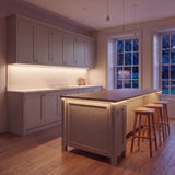 Warm White 2700K COB LED strip kitchen island lighting in a large British kitchen in the evening; installation illustration.