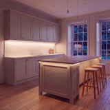 Warm White 3000K COB LED strip kitchen island lighting in a large British kitchen in the evening; installation illustration.