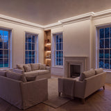 Natural White 4000K COB LED strip ceiling coving lighting in a large British living room in the evening; installation illustration.