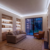 Cool White 6500K Free Cut COB LED strip ceiling coving lighting in a large British living room in the evening; installation illustration.