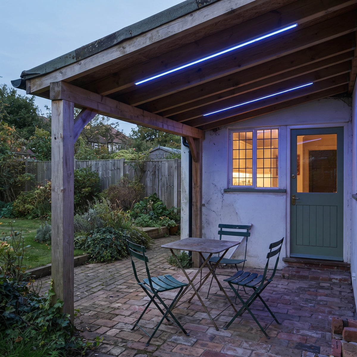 Blue RGB neon flex recessed beneath the roof beams of a covered UK patio