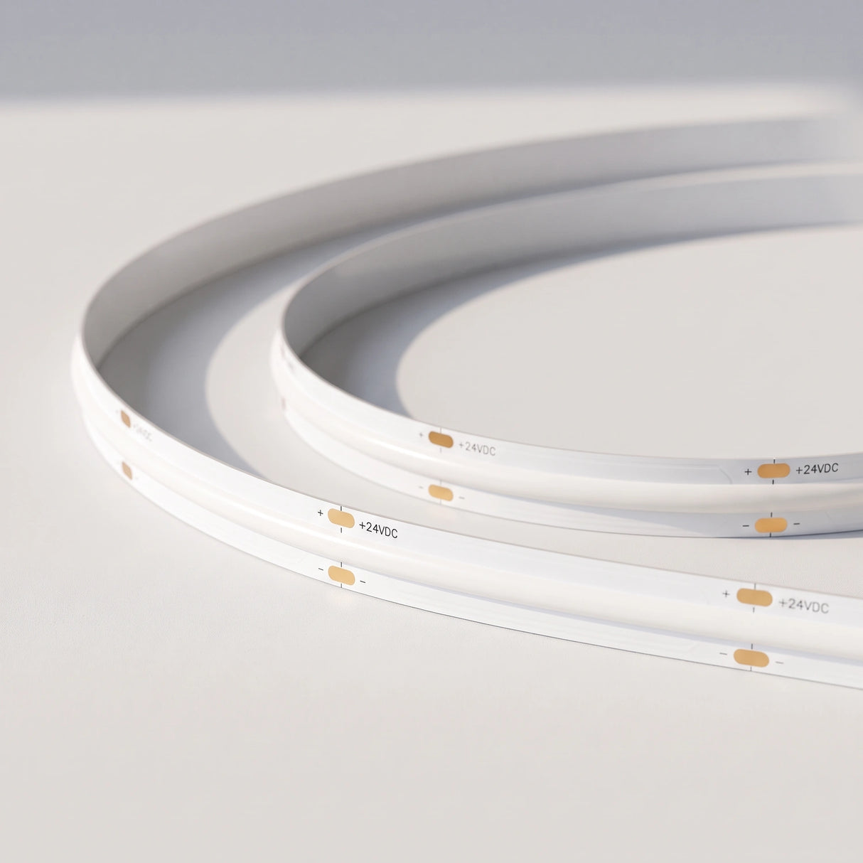 Unlit 10mm SCOB LED strip showing white board and 24V connection pads