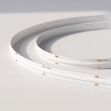 Unlit 10mm SCOB LED strip showing white board and 24V connection pads