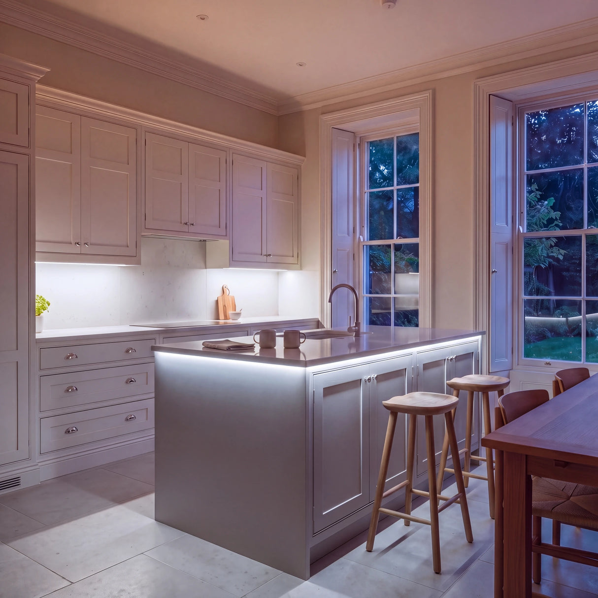 Daylight 5000K SCOB LED strip kitchen island lighting in a large British kitchen in the evening; installation illustration.