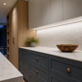 Illustrative spacious slate-and-oak kitchen with daylight-white 5000K SCOB LED lighting along a dry pantry worktop.