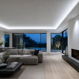 Illustrative modern house living space with cool-white 6500K SCOB LED lighting concealed around the ceiling perimeter.
