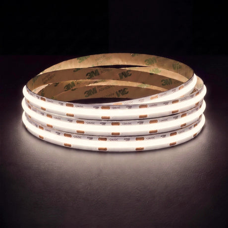 Natural white 4000K SCOB LED strip coil illuminated on a dark background, 24V DC and 10mm wide, with copper connection pads