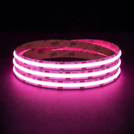 Pink SCOB LED strip coil illuminated on a dark background, 24V DC and 10mm wide, with copper connection pads