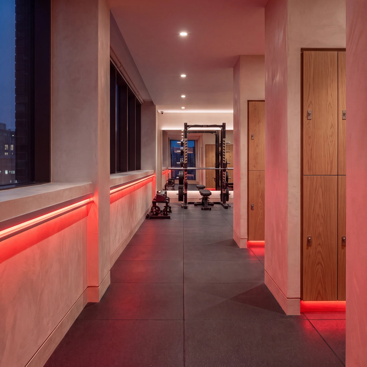 Red SCOB LED strip lighting along a fitness corridor beside oak lockers and a strength-training area; installation illustration.