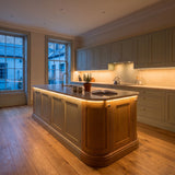 Warm White 2700K 24V 10mm COB LED strip installed beneath cabinets and around a British kitchen island; installation visual.
