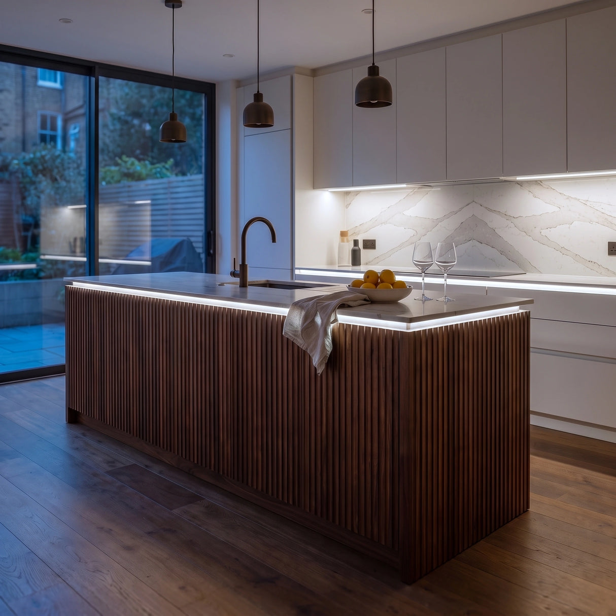 Daylight 5000K 24V 10mm SCOB LED strip installed beneath cabinets and around a British kitchen island; installation visual.