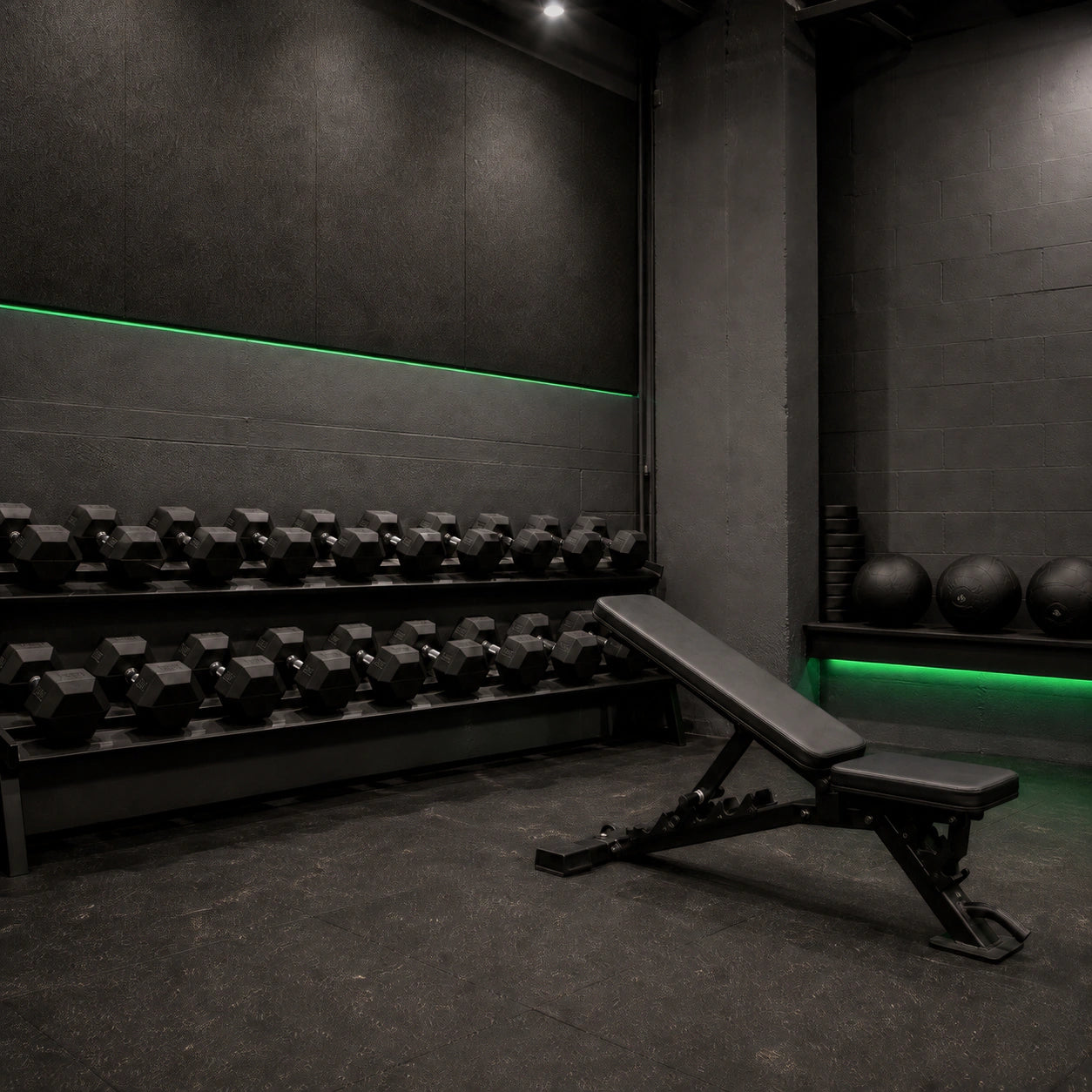 Green LED strip lighting in a commercial gym free weights area
